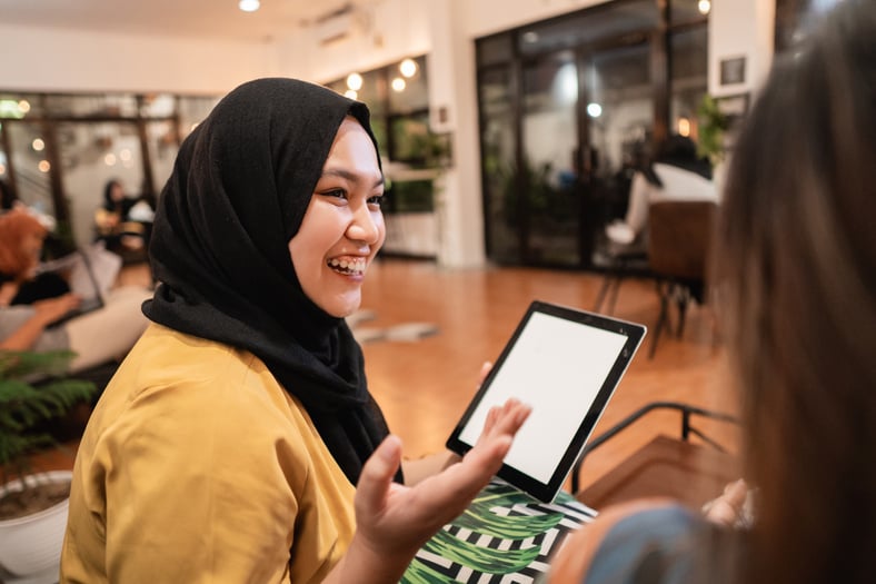 Hijab Girl Using Tablet When Enjoy Chatting